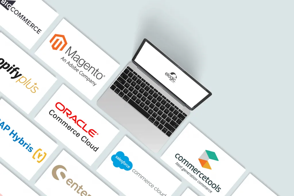 A computer and screens with logos of enterprise ecommerce platforms